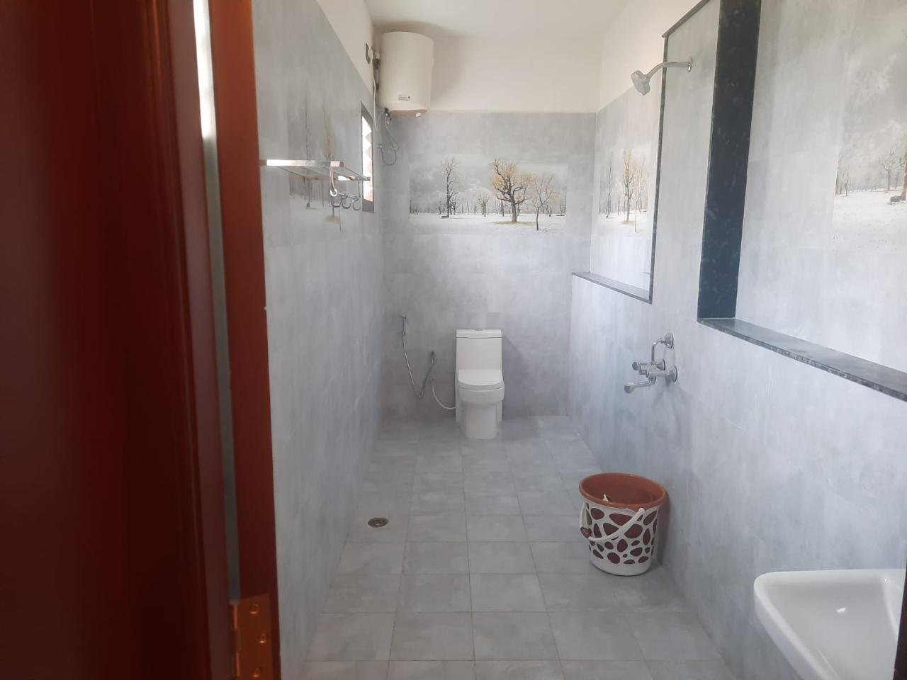 Attached bathroom with modern geyser hot water shower
