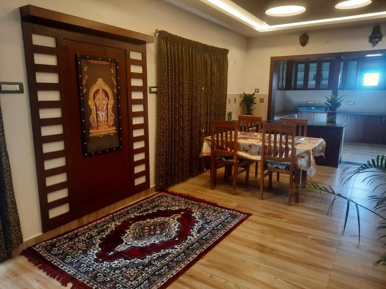 Traditional Vellapar devotional wall art and dining area