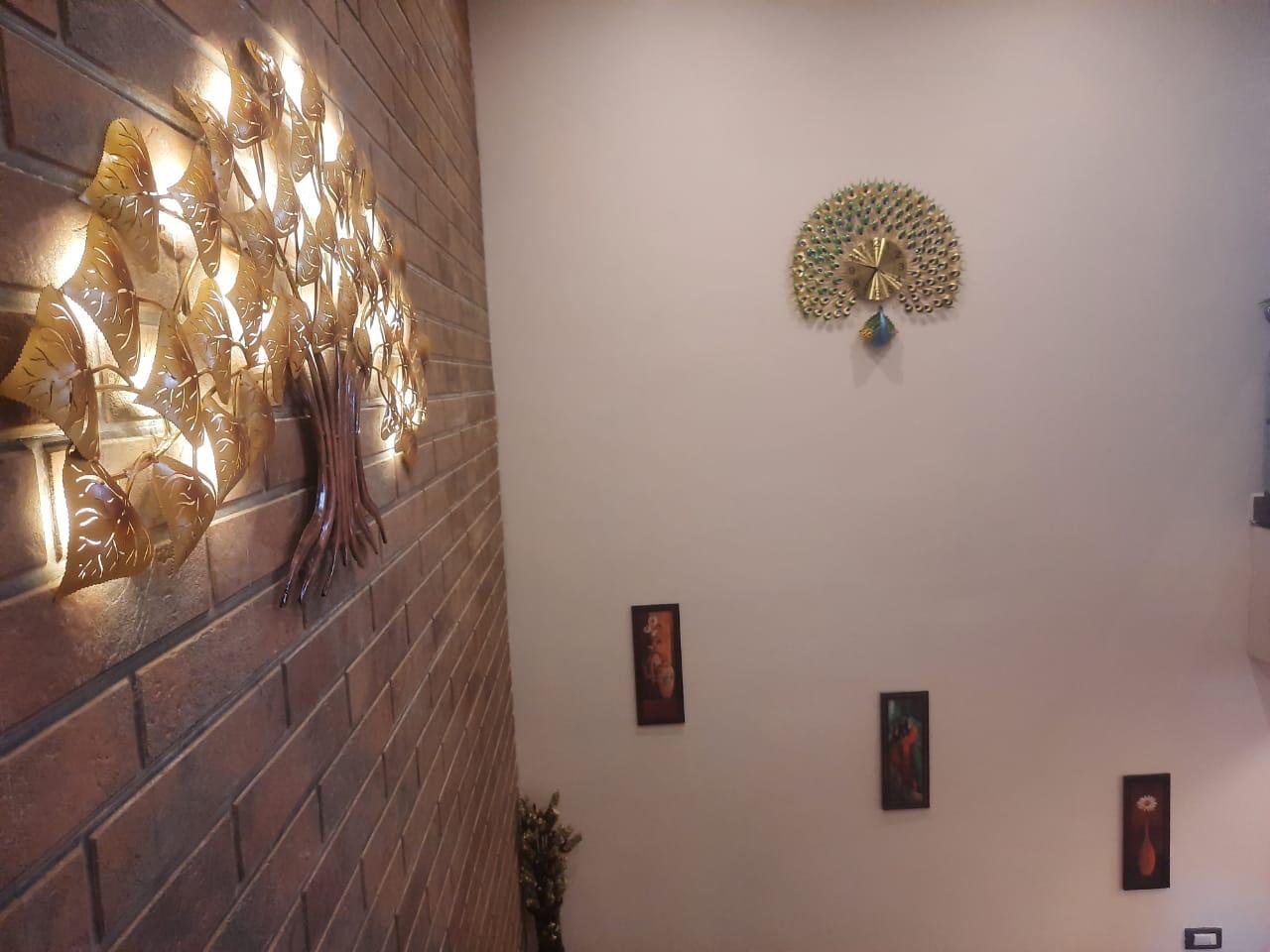 Staircase brick wall tree of life sculpture