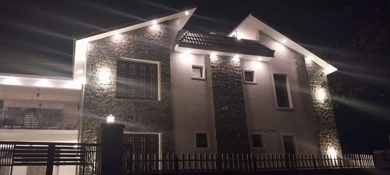 Kodai Vellapar cottage facade with warm architectural spot lighting